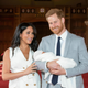 Britain’s Prince Harry and Meghan, Duchess of Sussex, during a photocall with their newborn son, in St George’s Hall at Windsor Castle, Windsor, south England, Wednesday May 8, 2019.